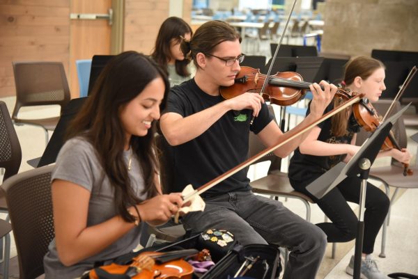 Violinist for the Red River Ensemble Practice their piece on  Sept. 13, 2023. The orchestra meets for practice on Mondays at Dell Seton Medical Center.